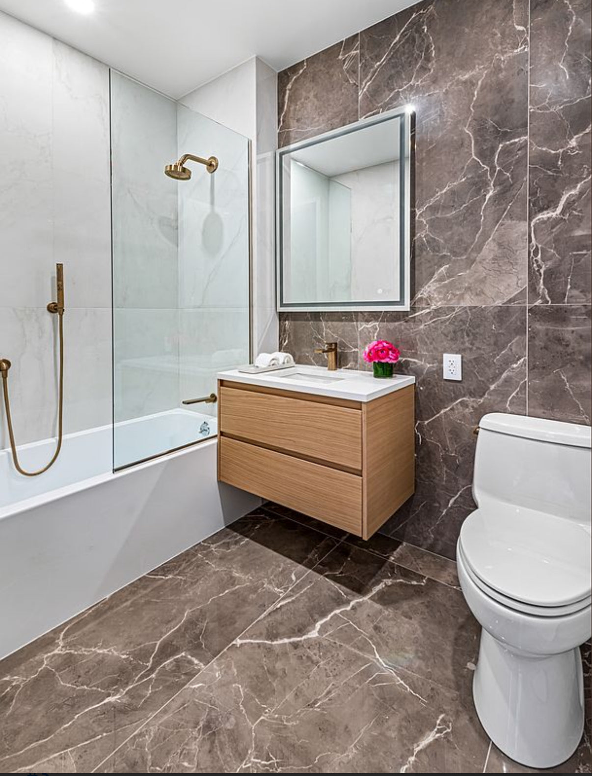 Contemporary bathroom with wood floating vanity and mixed marble tiles