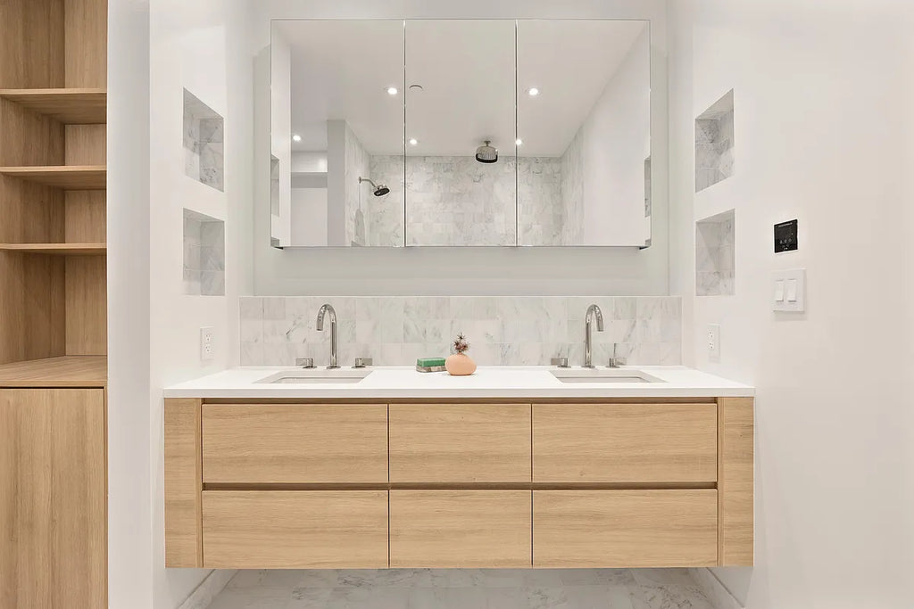 Contemporary bathroom with natural wood floating double vanity, marble backsplash, and mirror medicine cabinets