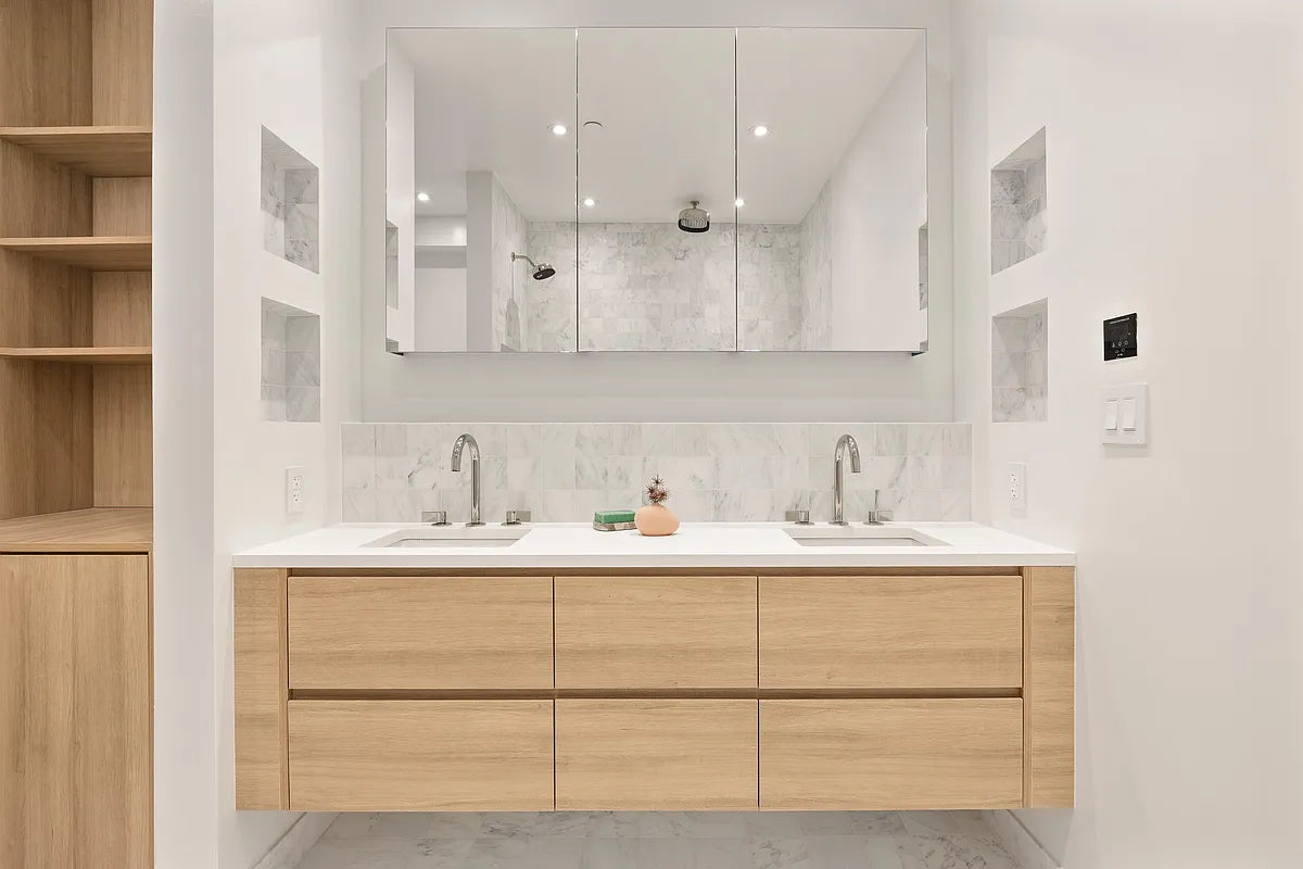 Contemporary bathroom with natural wood floating double vanity, marble backsplash, and mirror medicine cabinets