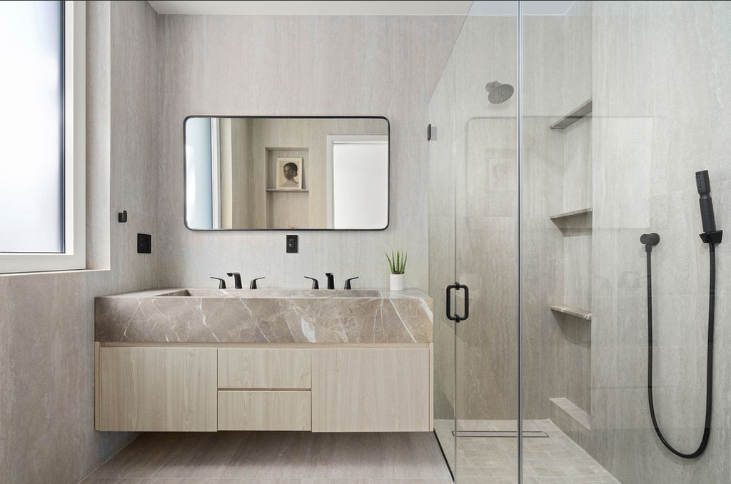 Modern bathroom with floating marble vanity and walk-in shower