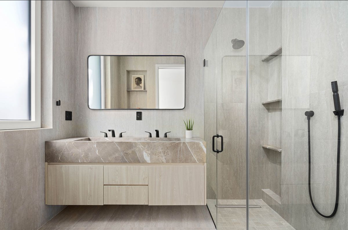 Modern bathroom with floating marble vanity and walk-in shower